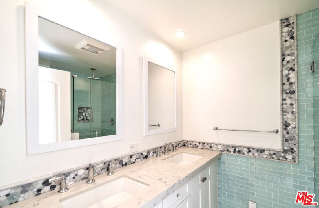 122 Montreal Street Playa del Rey, CA 90293 - Photo 15 of 30 a bathroom with a granite countertop sink and a mirror