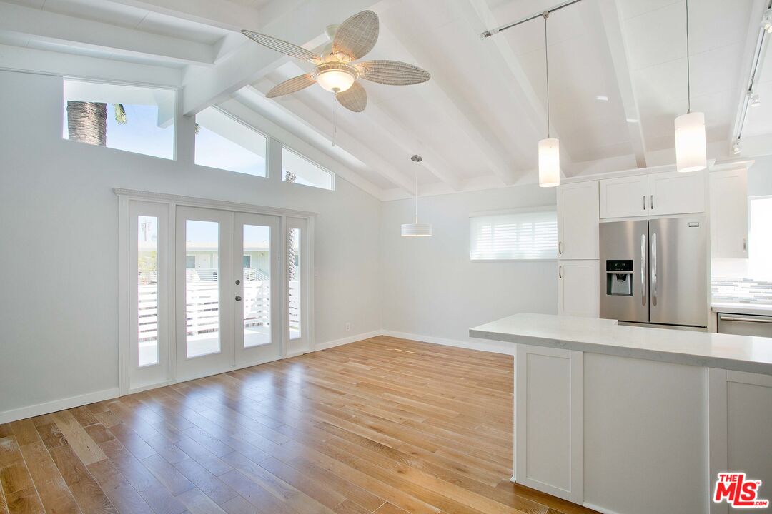 122 Montreal Street Playa del Rey, CA 90293 - Photo 5 of 30 a view of an empty room with kitchen view and a window