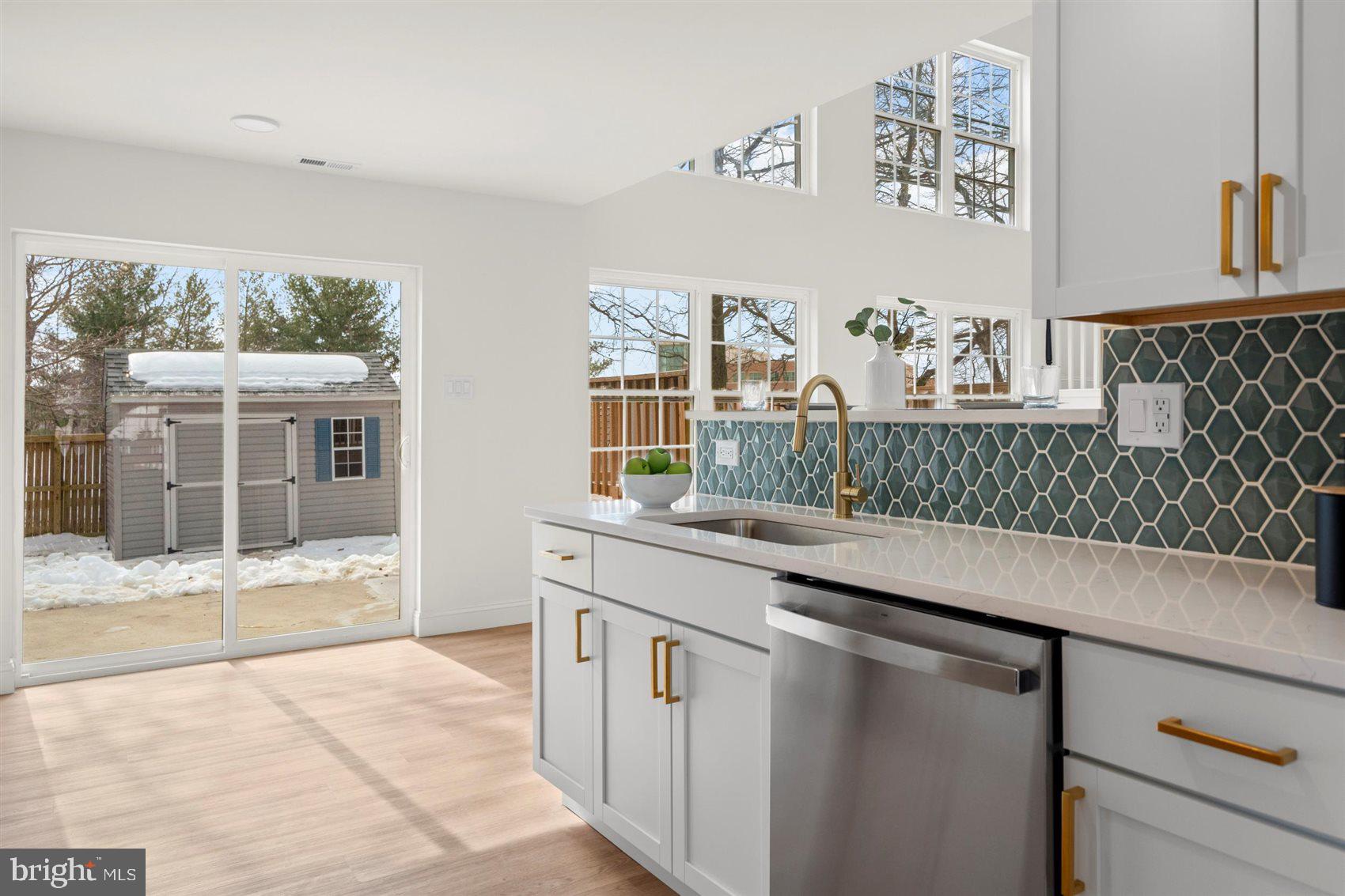 304 Canoe Lane Edgewood, MD 21040 - Photo 17 of 41 a kitchen with stainless steel appliances a sink and a window