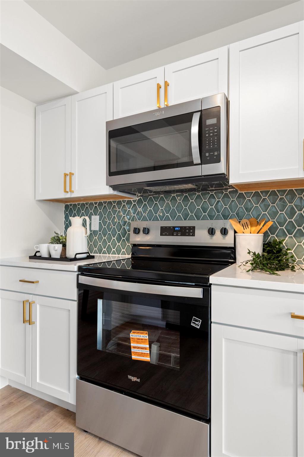 304 Canoe Lane Edgewood, MD 21040 - Photo 20 of 41 a kitchen with stainless steel appliances granite countertop a stove microwave and sink