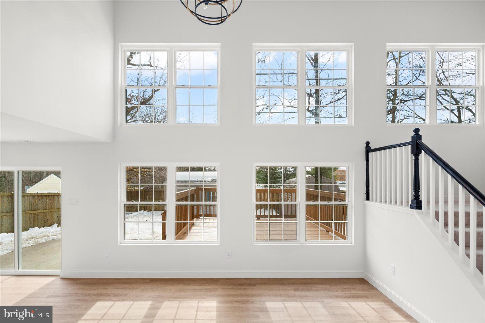 304 Canoe Lane Edgewood, MD 21040 - Photo 23 of 41 an empty room with wooden floor and windows