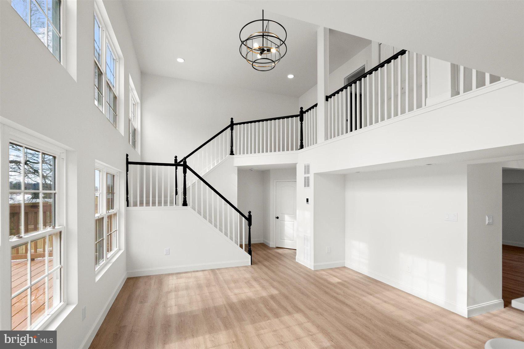 304 Canoe Lane Edgewood, MD 21040 - Photo 24 of 41 a view of hallway with wooden floor and stairs