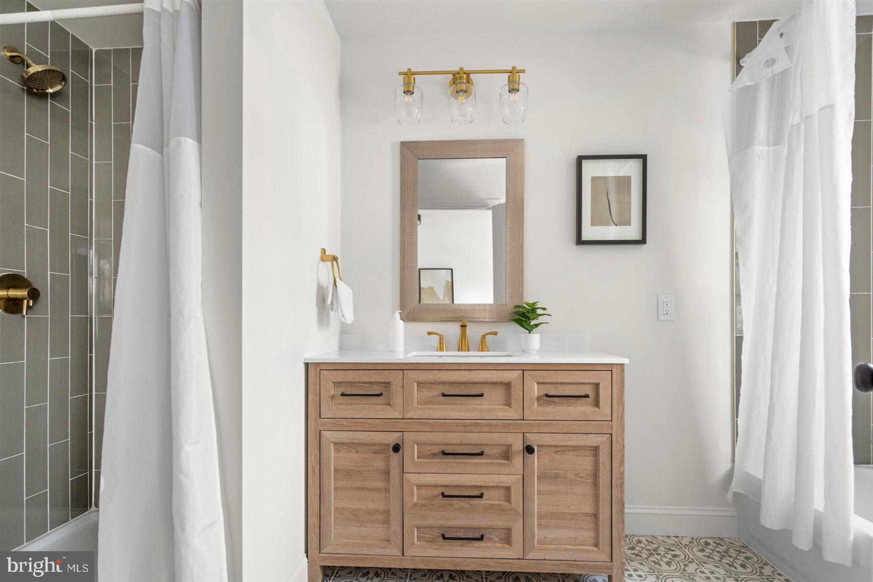 304 Canoe Lane Edgewood, MD 21040 - Photo 32 of 41 a bathroom with a granite countertop sink a mirror and a