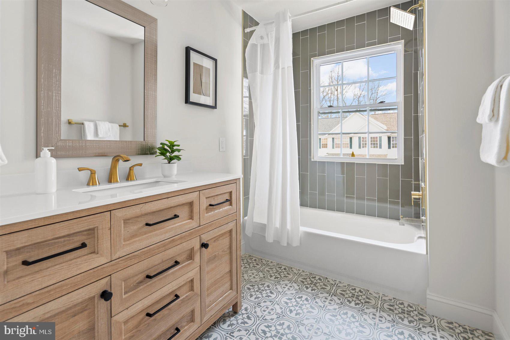 304 Canoe Lane Edgewood, MD 21040 - Photo 34 of 41 a bathroom with a shower sink and mirror