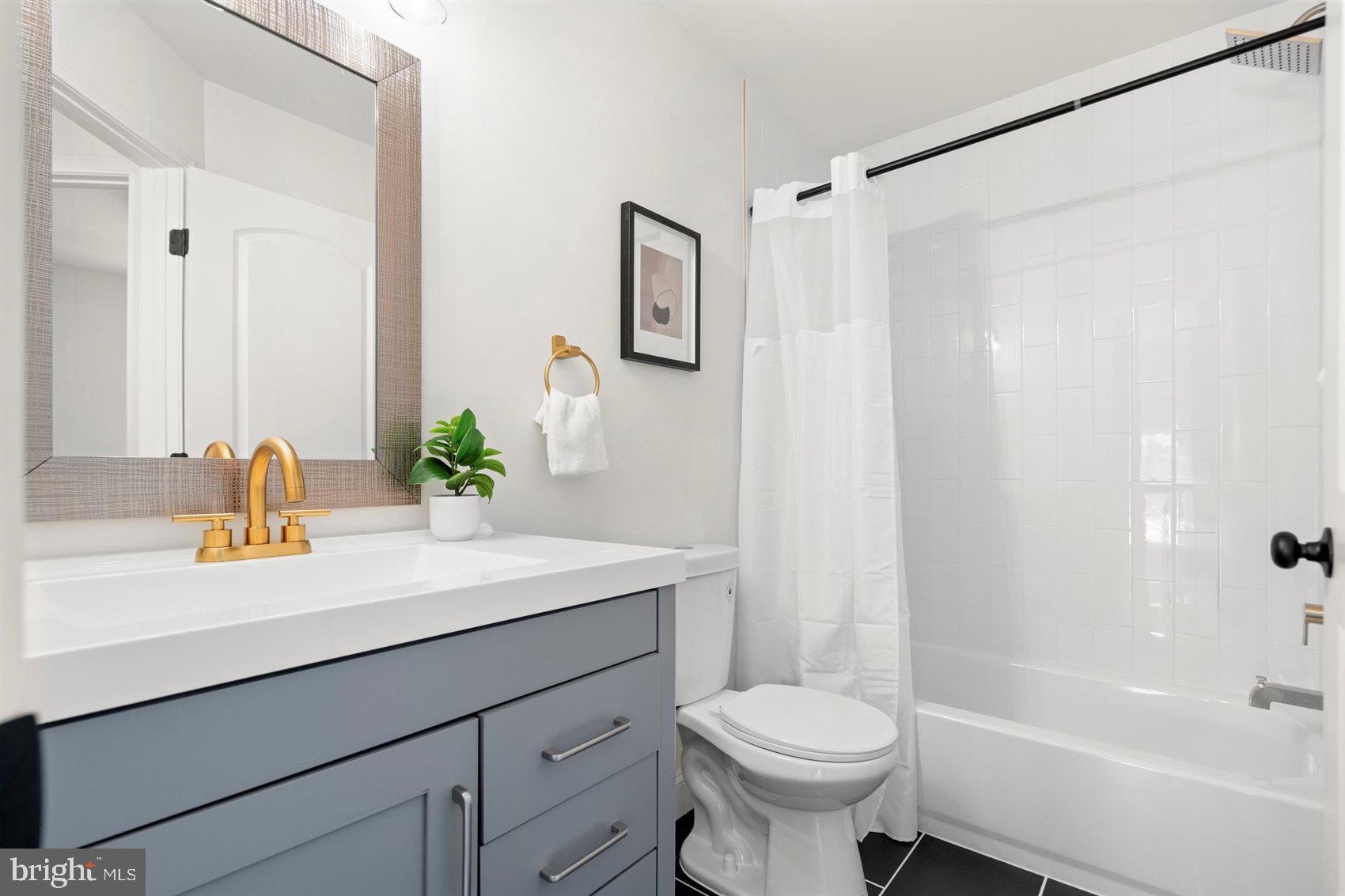 304 Canoe Lane Edgewood, MD 21040 - Photo 36 of 41 a bathroom with a sink a toilet and shower