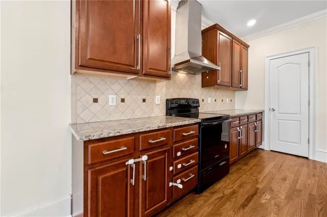 a kitchen with stainless steel appliances granite countertop a stove and a sink