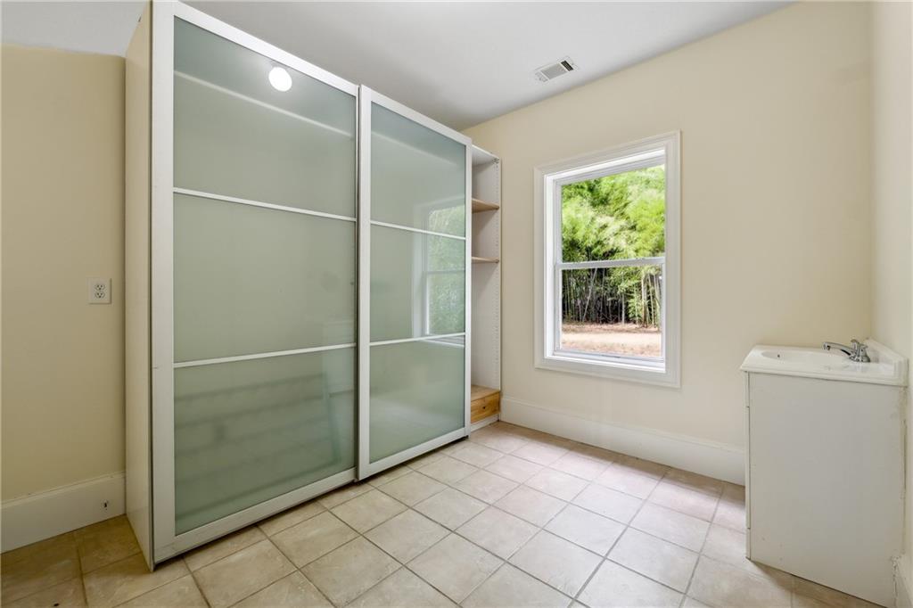 1303 North Druid Hills Road Brookhaven, GA 30319 - Photo 22 of 56 a view of an empty room with a window
