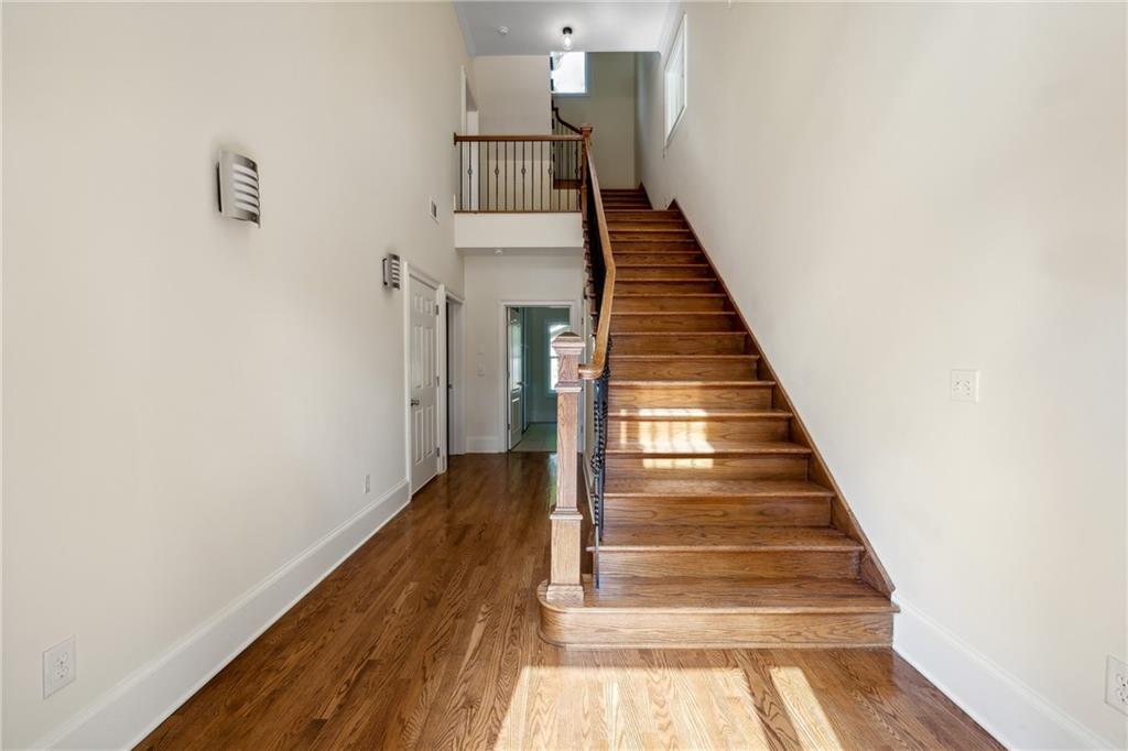 1303 North Druid Hills Road Brookhaven, GA 30319 - Photo 3 of 56 a view of entryway and hall with wooden floor