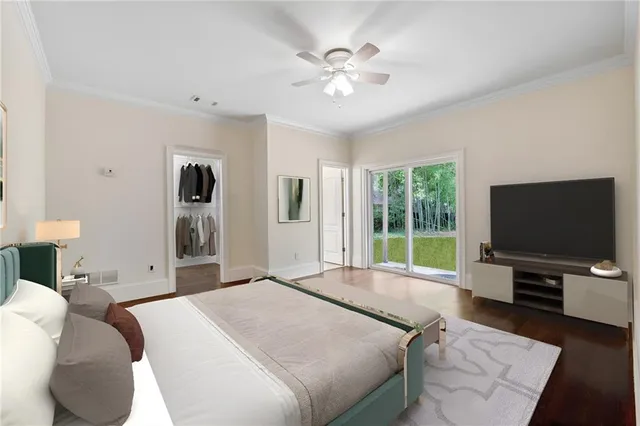 a bedroom with a large bed and a window