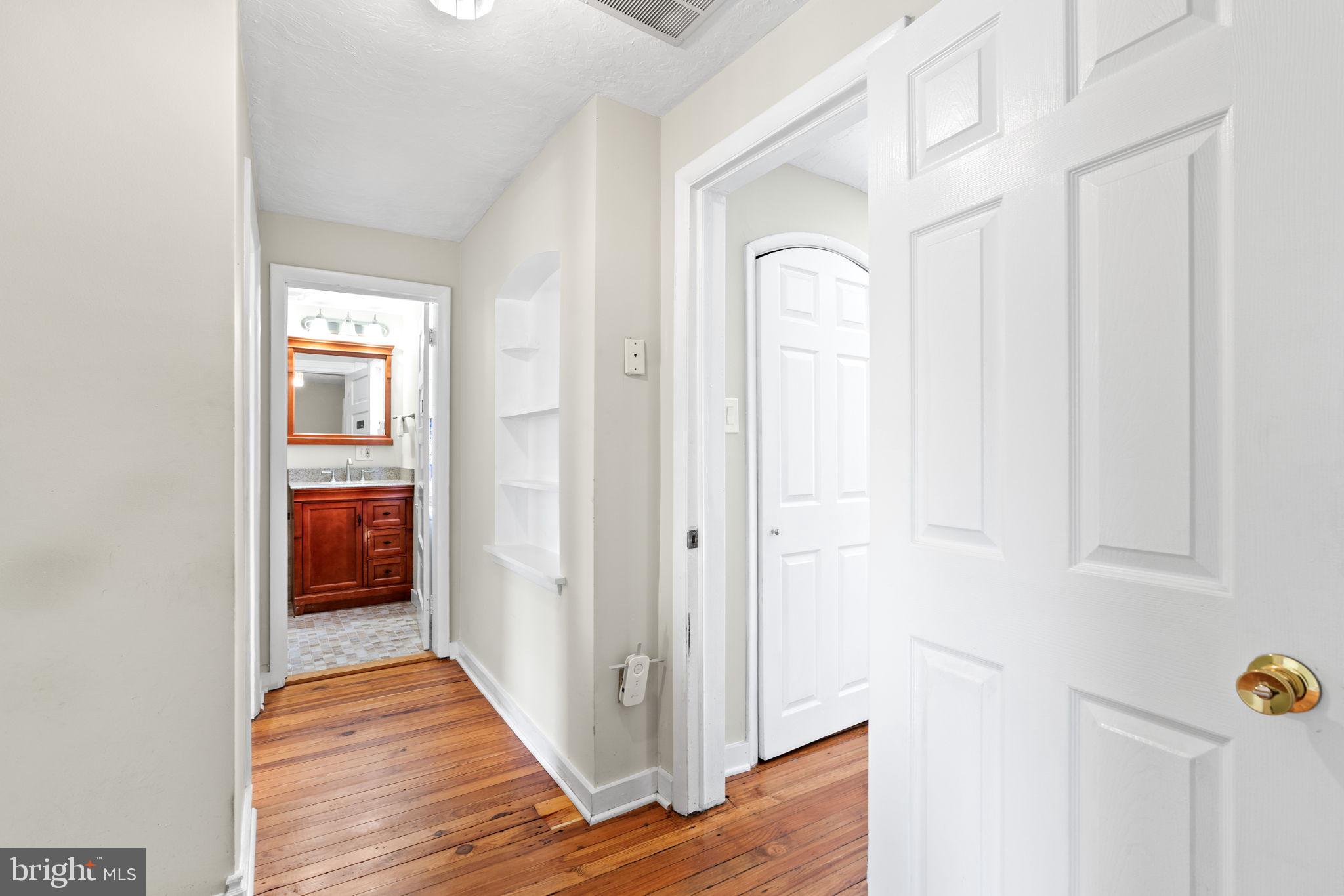5002 Burkittsville Road Jefferson, MD 21755 - Photo 18 of 40 Bright hallway with warm wood floors.