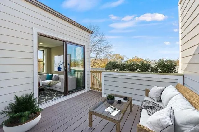 a view of backyard with seating space and deck