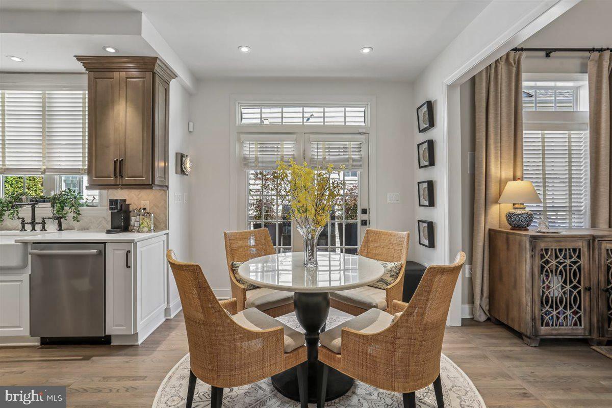 3738 Gleneagles Drive Silver Spring, MD 20906 - Photo 16 of 71 a view of a dining room with furniture window and wooden floor