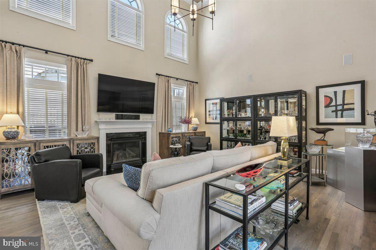 3738 Gleneagles Drive Silver Spring, MD 20906 - Photo 22 of 71 a living room with fireplace furniture and a flat screen tv