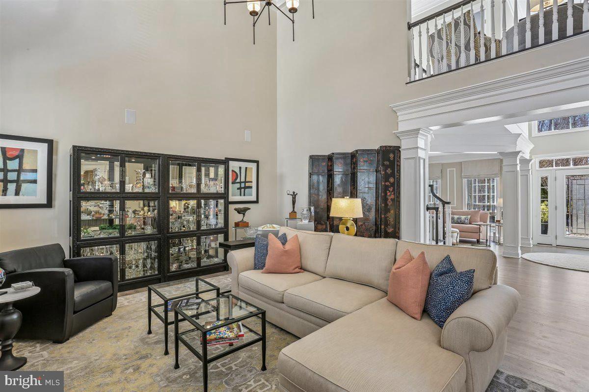 3738 Gleneagles Drive Silver Spring, MD 20906 - Photo 23 of 71 a living room with furniture and a floor to ceiling window