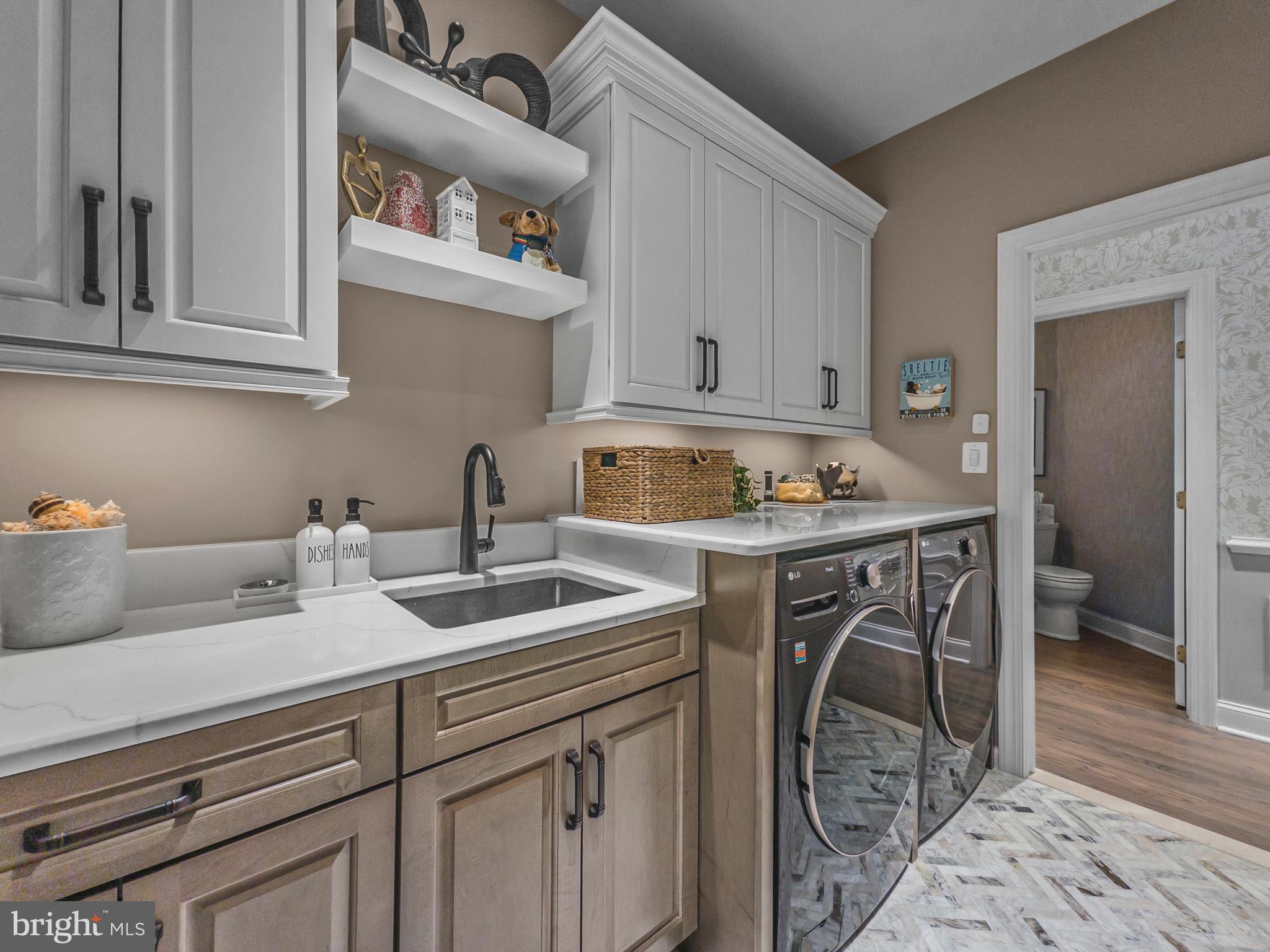 3738 Gleneagles Drive Silver Spring, MD 20906 - Photo 32 of 71 a kitchen with a sink stove and cabinets