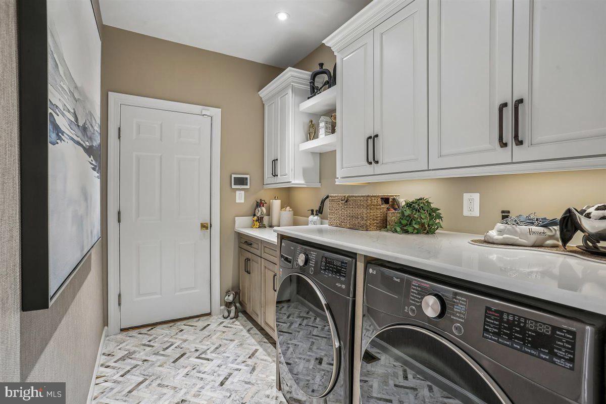 3738 Gleneagles Drive Silver Spring, MD 20906 - Photo 33 of 71 a utility room with sink dryer and washer