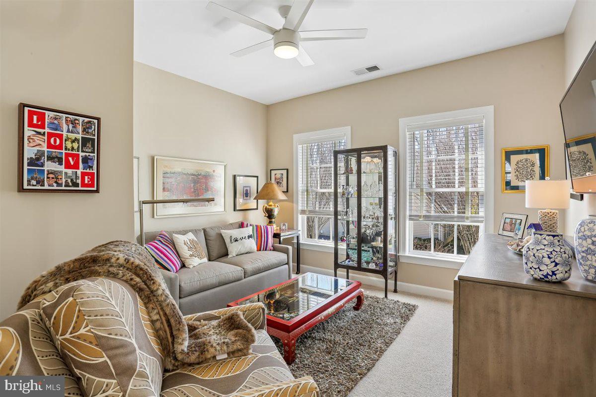 3738 Gleneagles Drive Silver Spring, MD 20906 - Photo 39 of 71 a living room with furniture and a window
