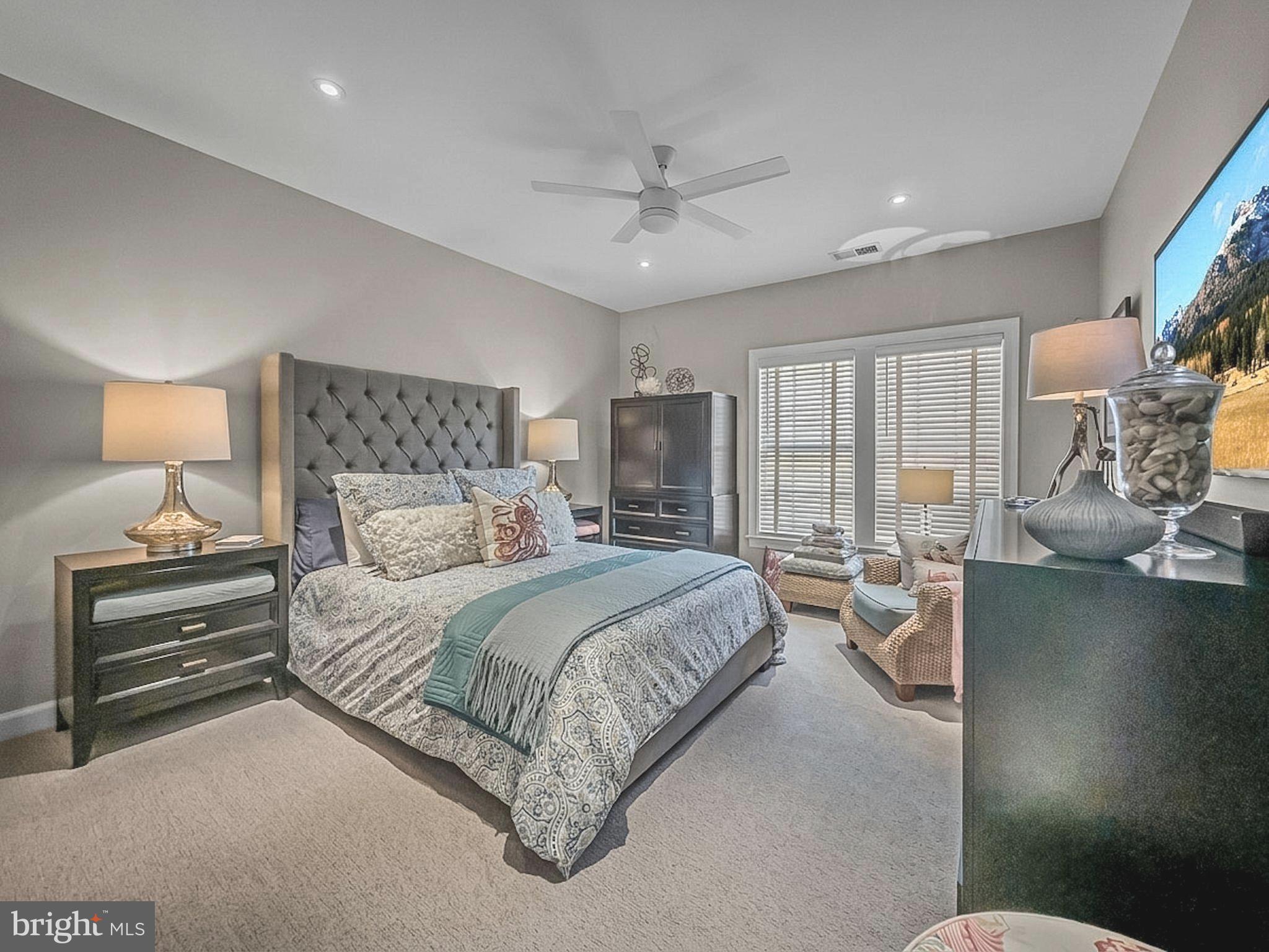 3738 Gleneagles Drive Silver Spring, MD 20906 - Photo 40 of 71 a spacious bedroom with a bed and large mirror