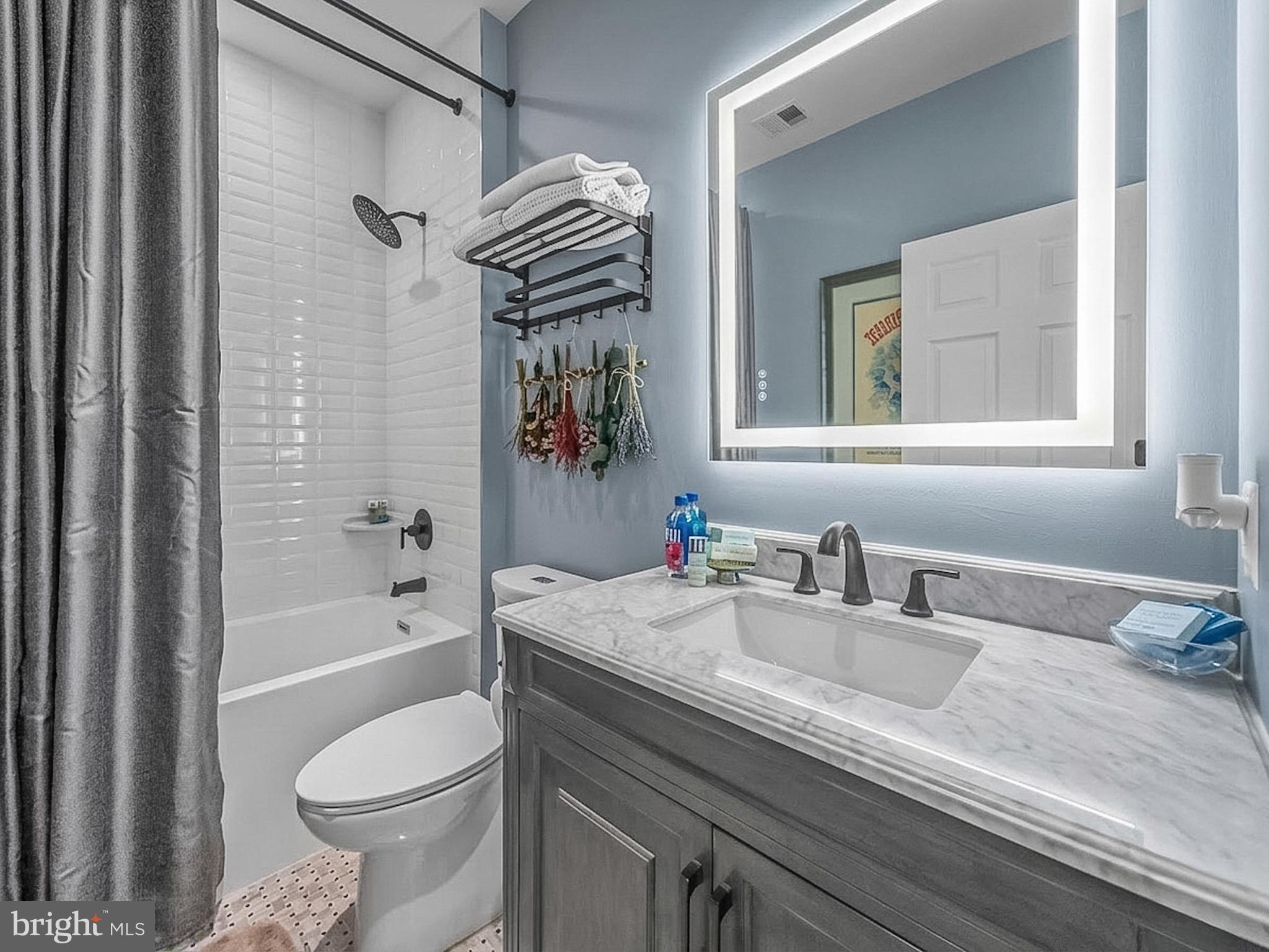 3738 Gleneagles Drive Silver Spring, MD 20906 - Photo 46 of 71 a bathroom with a granite countertop sink a toilet and shower