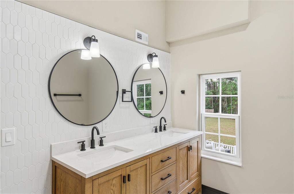 14728 Henson Road Orlando, FL 32832 - Photo 46 of 79 a bathroom with a sink and a mirror