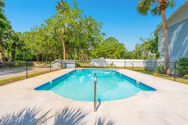 a view of a swimming pool with a patio