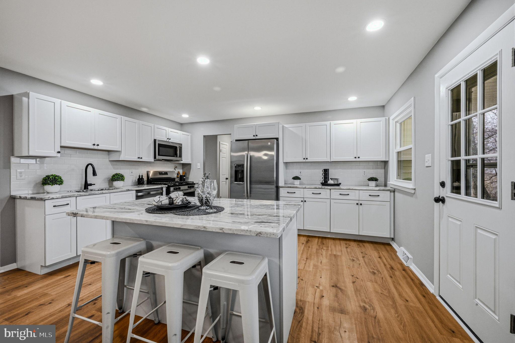 1302 Stanford Road Wilmington, DE 19803 - Photo 7 of 39 Modern kitchen with sleek design and light.