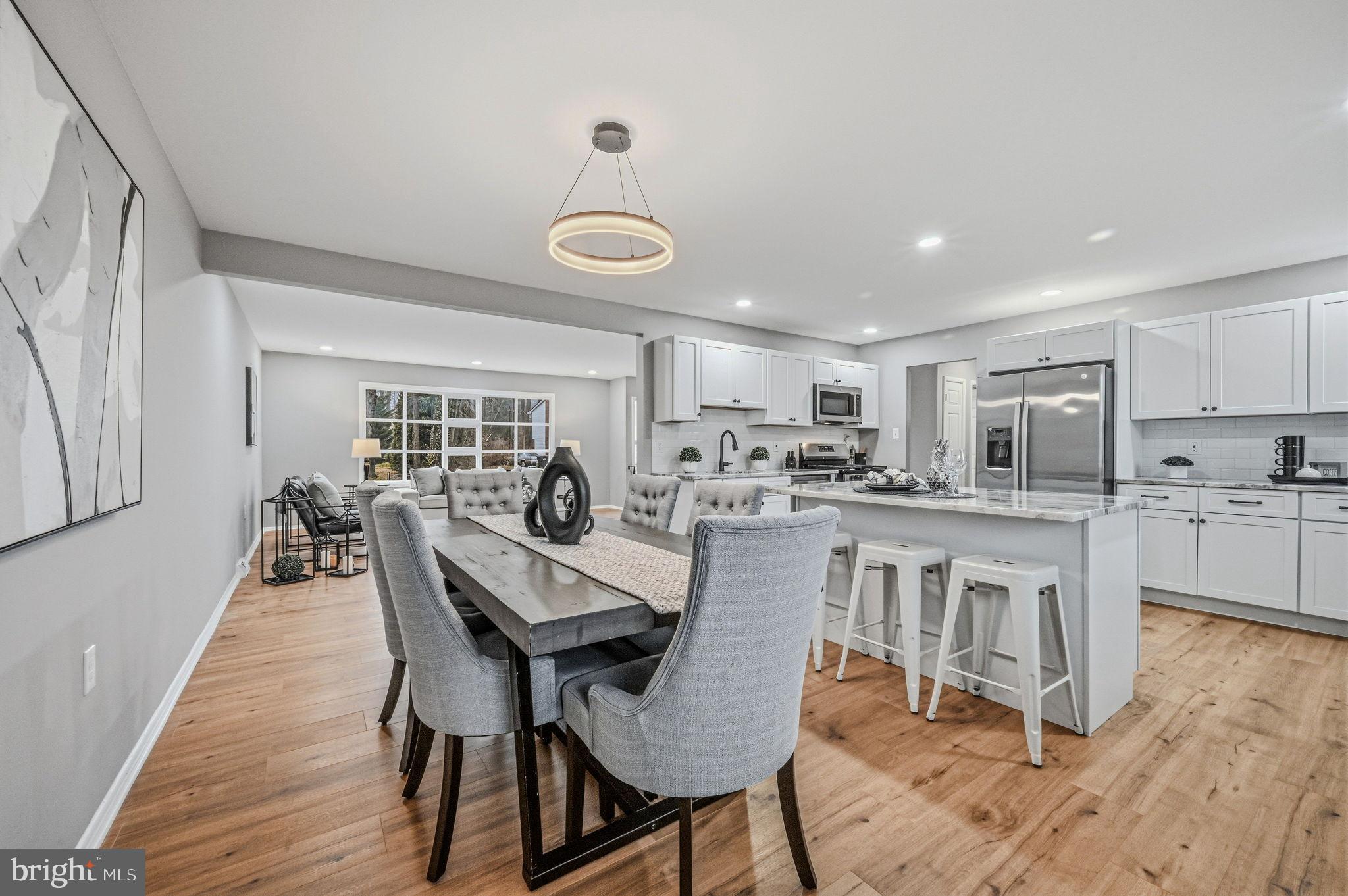 1302 Stanford Road Wilmington, DE 19803 - Photo 8 of 39 Modern elegance in a spacious kitchen-dining area.