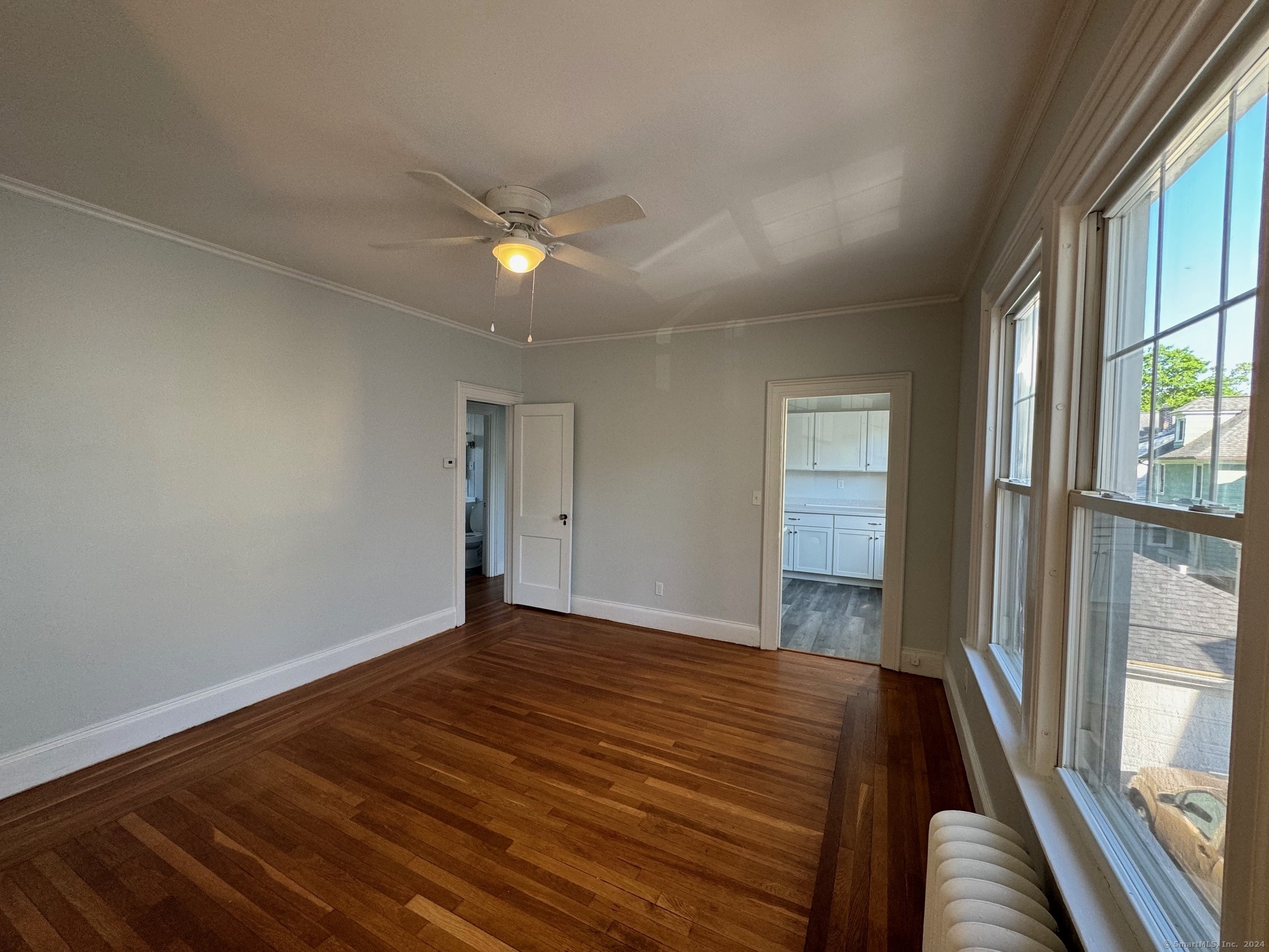 1253 Forest Road, Unit 2 New Haven, CT 06515 - Photo 16 of 30 a view of room with window and wooden floor