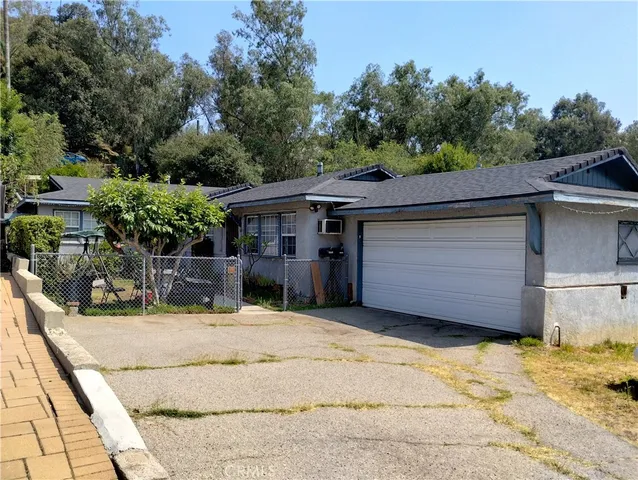 a backyard of a house with yard and garage