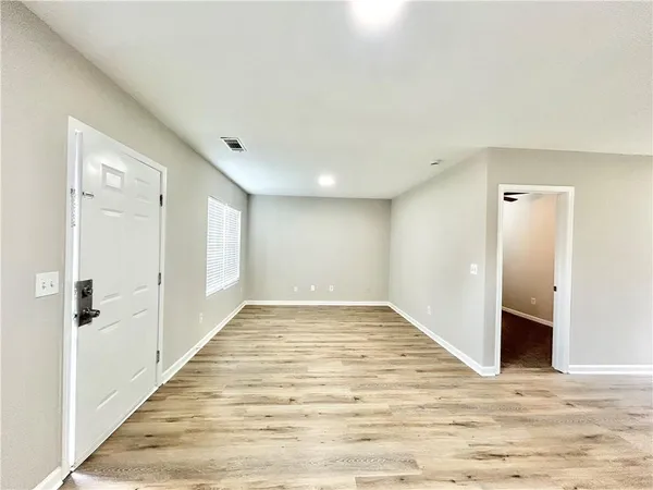a view of a livingroom with wooden floor