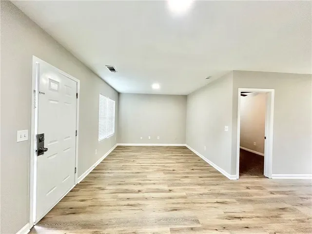 a view of a livingroom with wooden floor