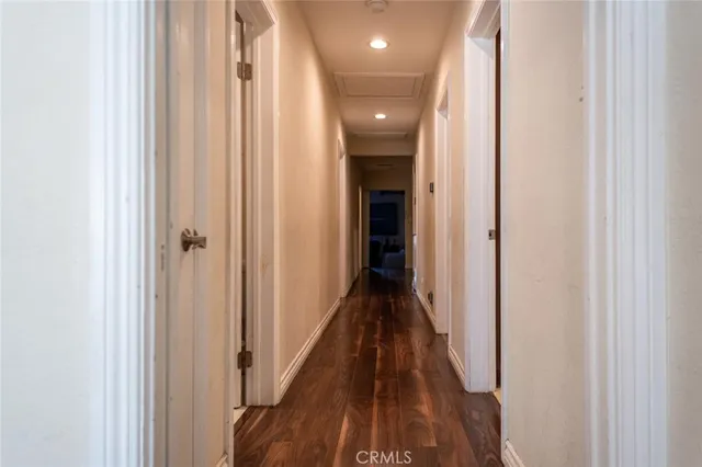 a view of a hallway with the wooden floor