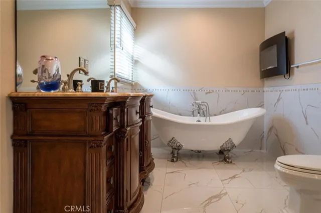 a bathroom with a sink toilet and mirror