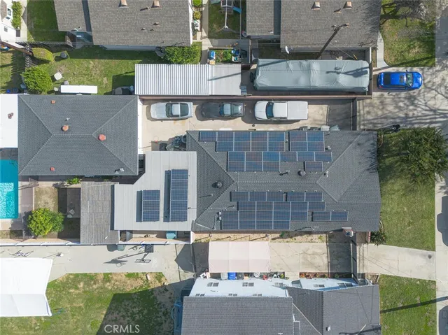 an aerial view of a house with a garden and plants