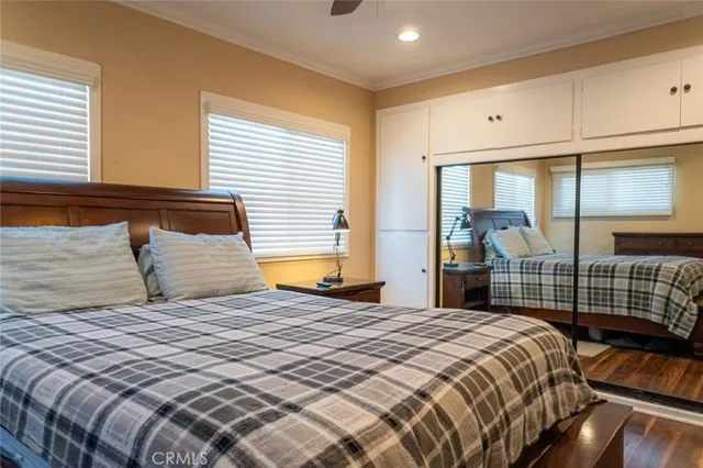 a bedroom with a large bed and a window