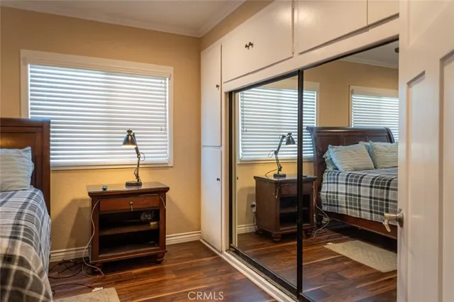 a bedroom with furniture and windows