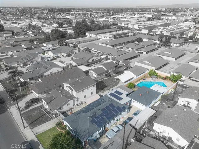 an aerial view of residential building and parking space