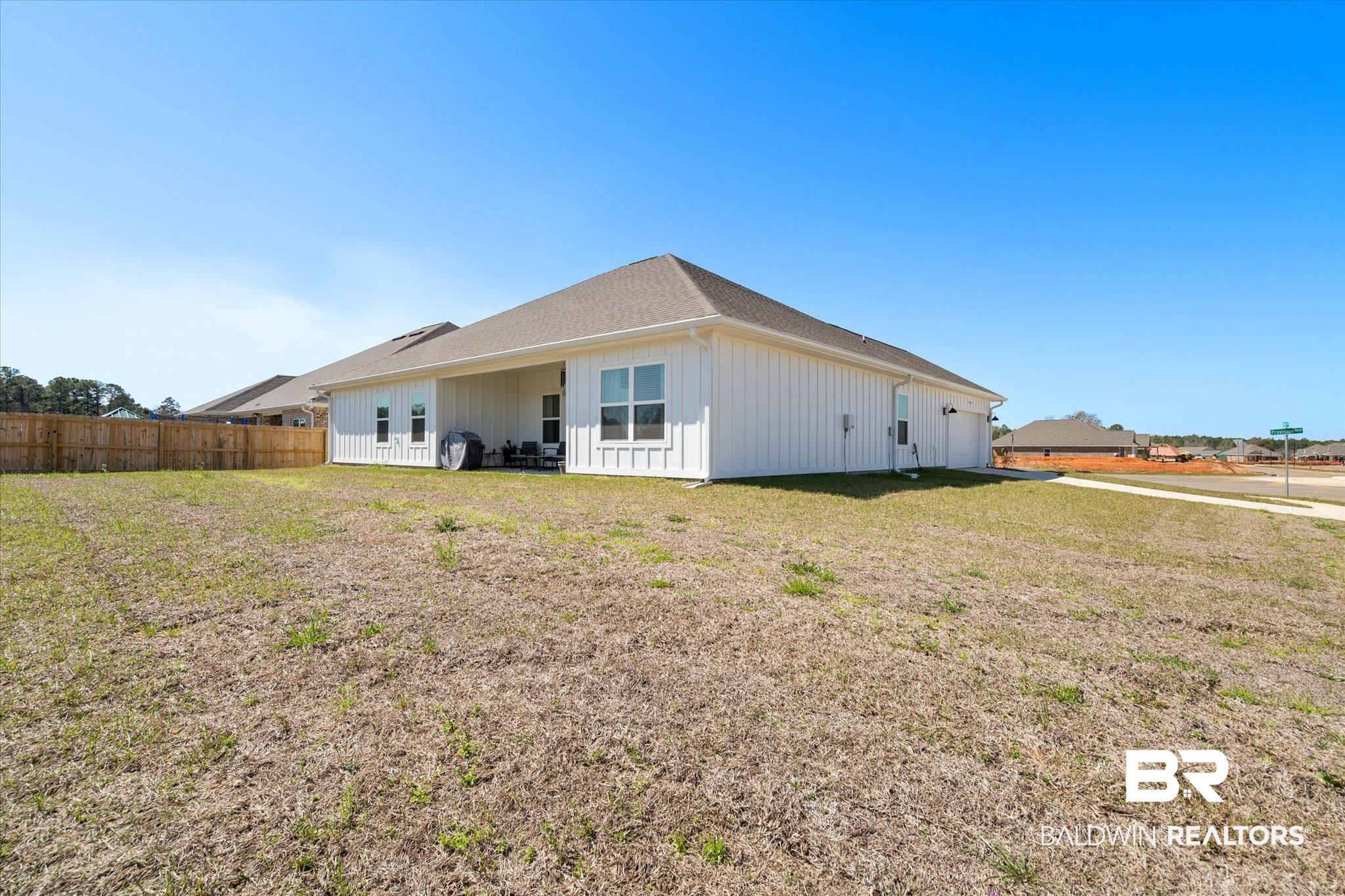 1167 Provision Road Mobile, AL 36608 - Photo 18 of 20 Back of property with a lawn and fence