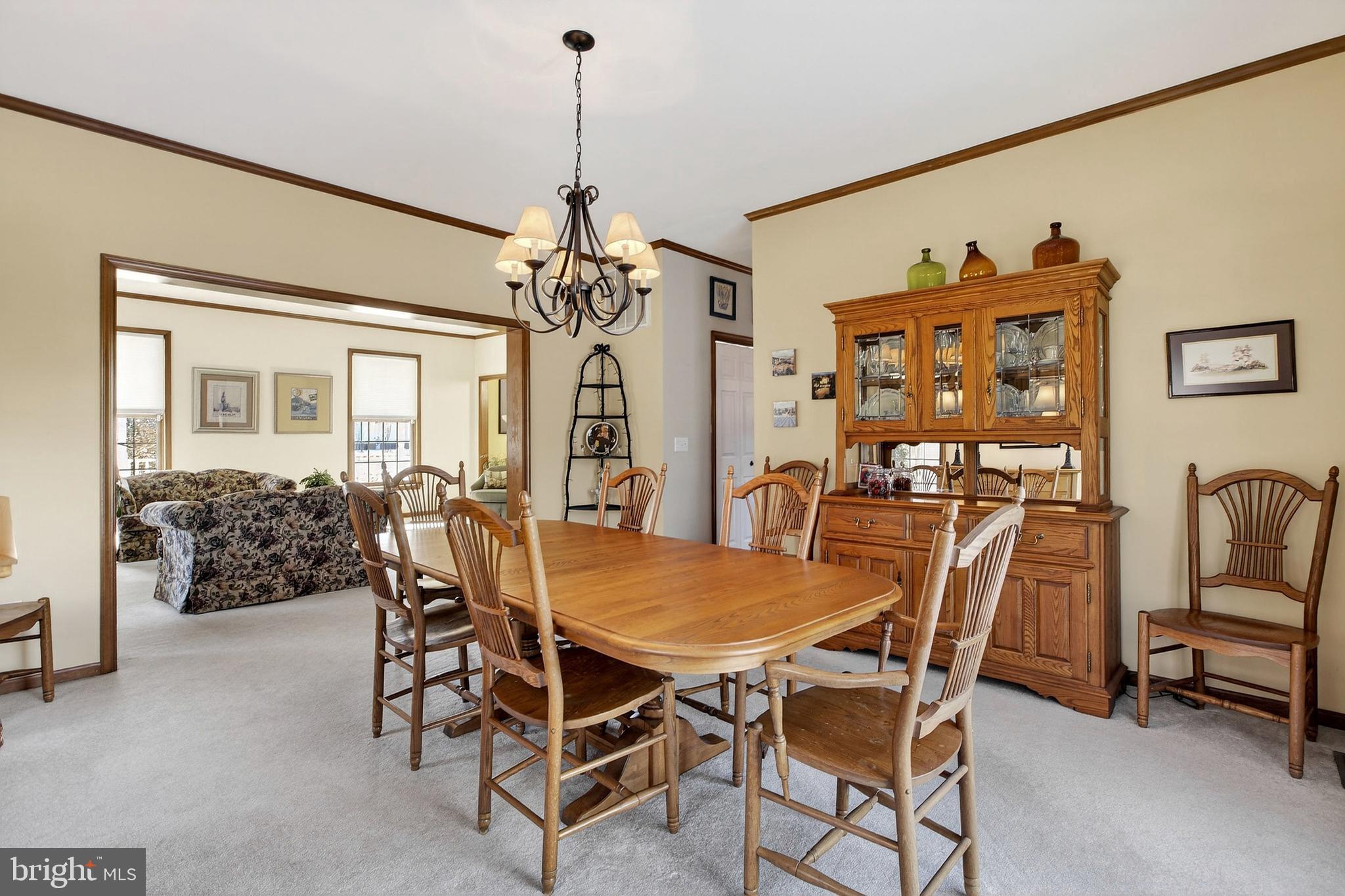 657 Vance Neck Road Middletown, DE 19709 - Photo 11 of 73 a view of a dining room with furniture and a chandelier