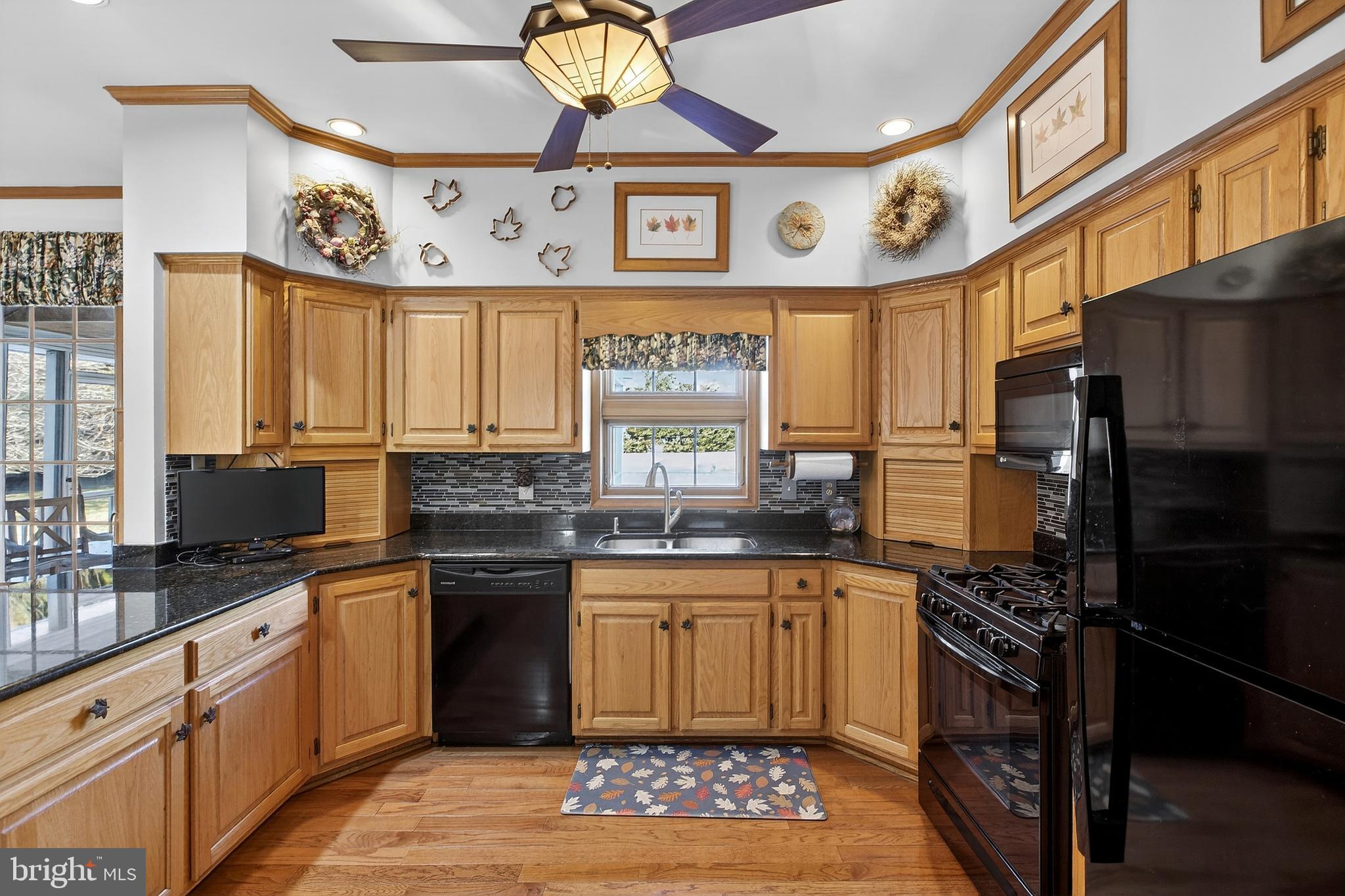 657 Vance Neck Road Middletown, DE 19709 - Photo 14 of 73 a kitchen with stainless steel appliances a stove a sink and a refrigerator