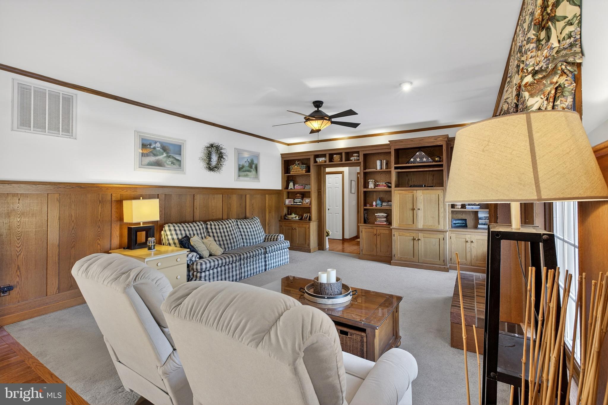 657 Vance Neck Road Middletown, DE 19709 - Photo 20 of 73 a living room with furniture and a flat screen tv