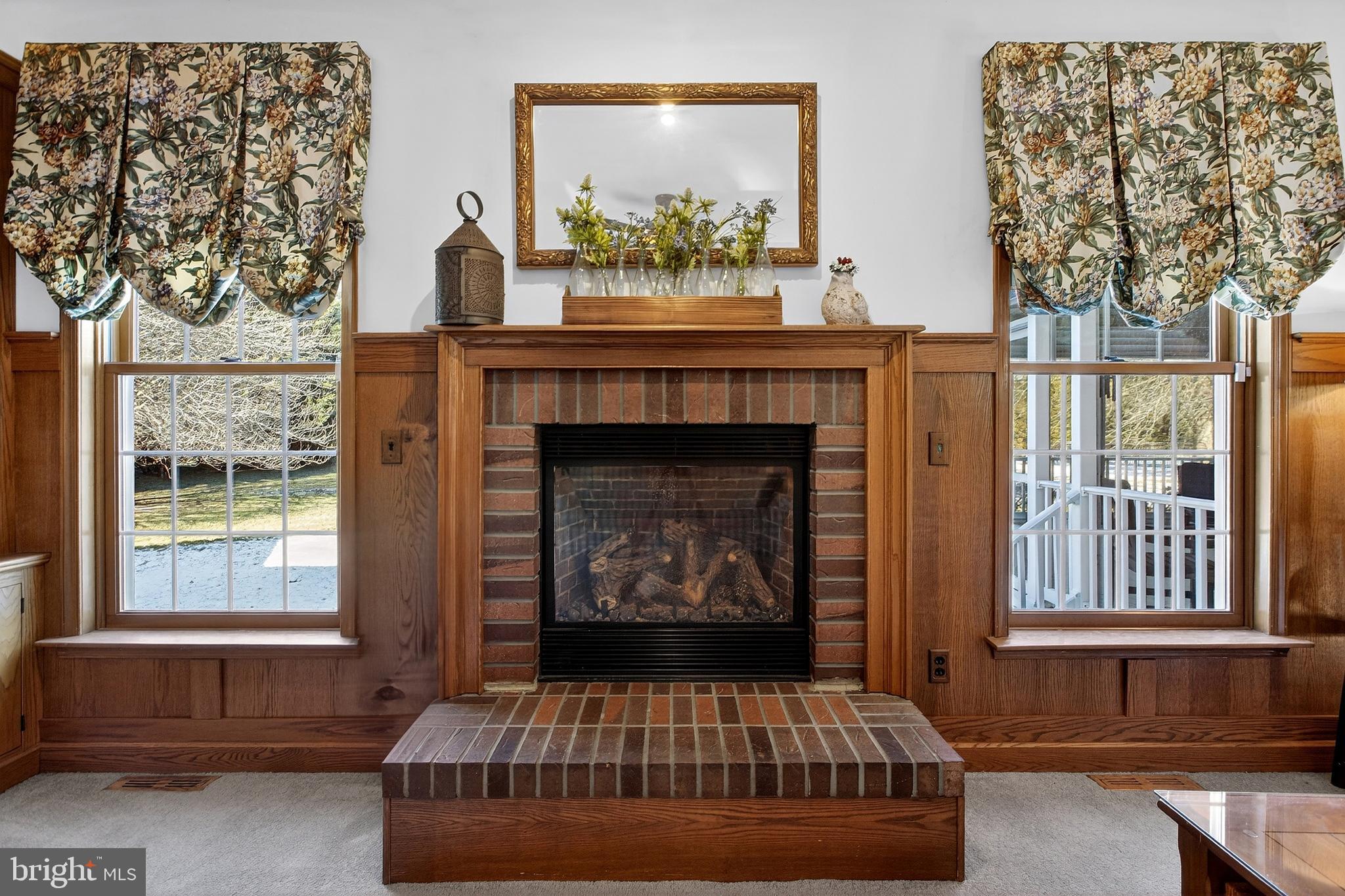 657 Vance Neck Road Middletown, DE 19709 - Photo 22 of 73 a living room with a fireplace and a large window