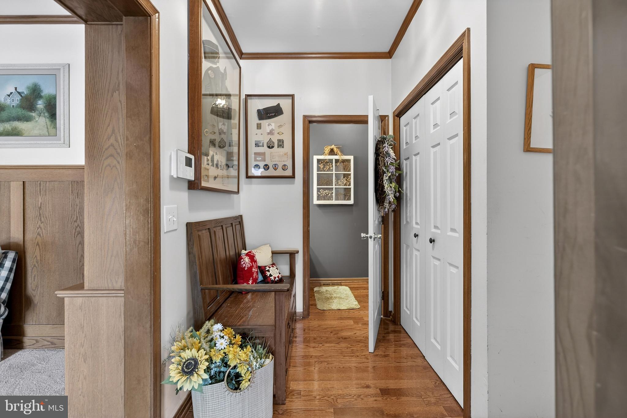 657 Vance Neck Road Middletown, DE 19709 - Photo 24 of 73 a view of a hallway with wooden floor and a dining room