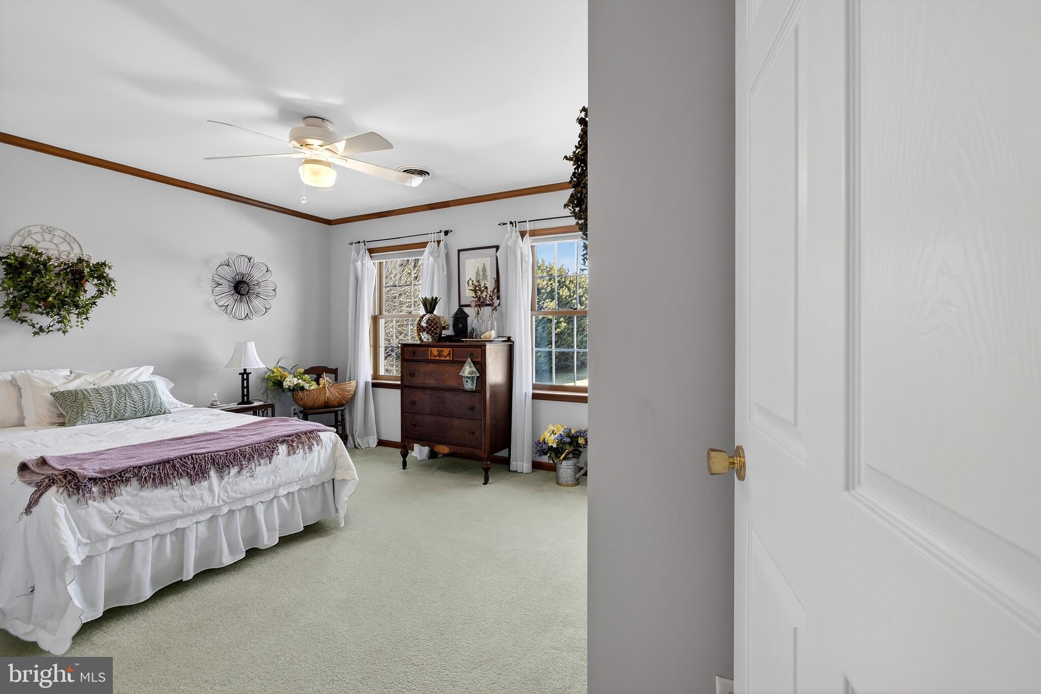 657 Vance Neck Road Middletown, DE 19709 - Photo 36 of 73 a bedroom with bed and a chandelier