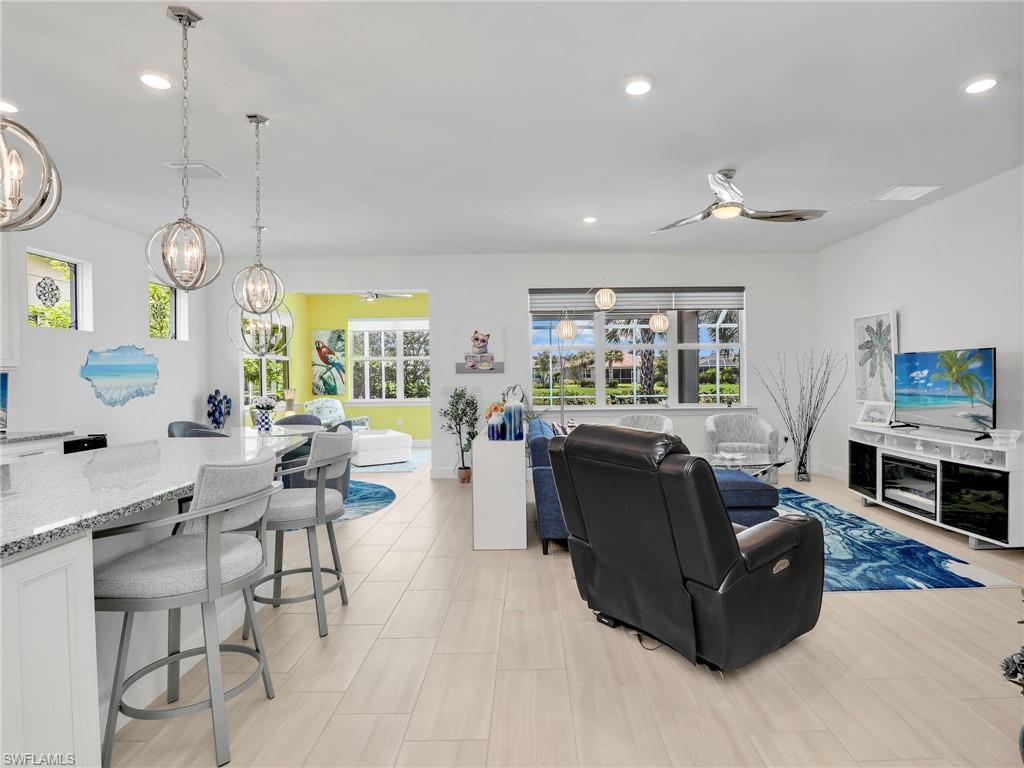 20064 Wymberly Way Estero, FL 33928 - Photo 11 of 47 a living room with fireplace furniture and a large window