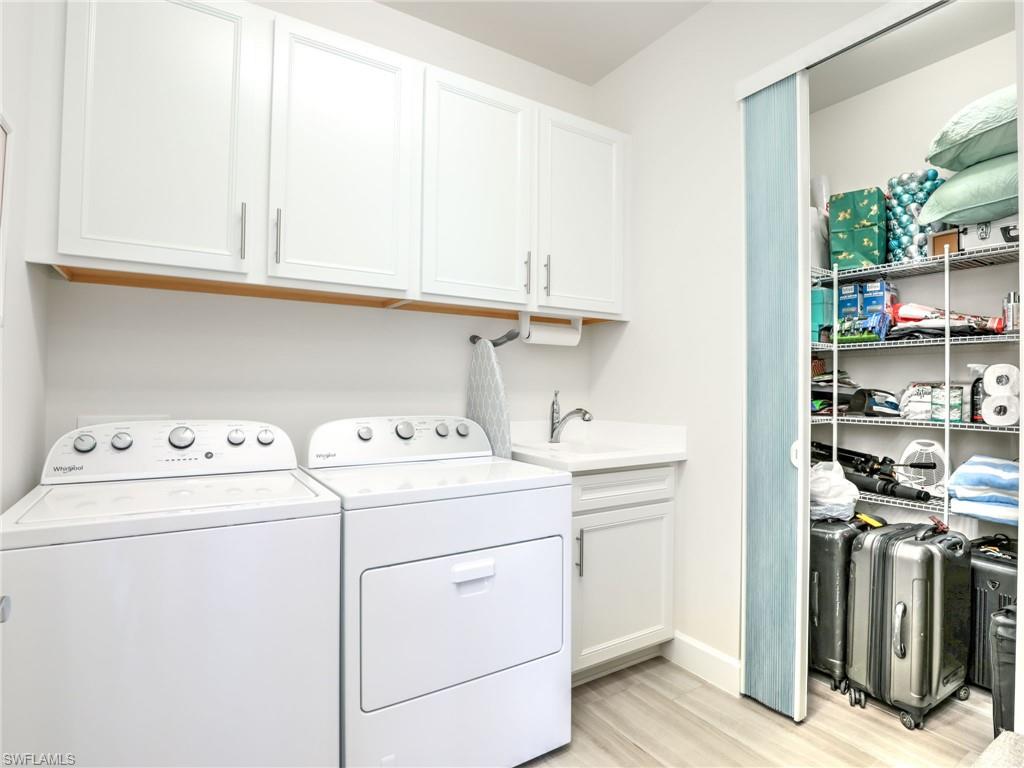 20064 Wymberly Way Estero, FL 33928 - Photo 28 of 47 a utility room with dryer and washer