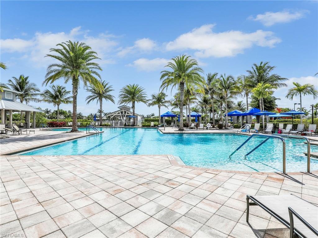 20064 Wymberly Way Estero, FL 33928 - Photo 34 of 47 a swimming pool with lawn chairs