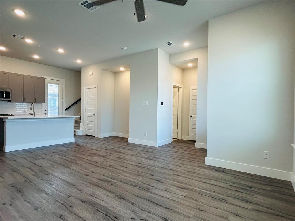 760 West Bedford Euless Road, Unit 200 Hurst, TX 76053 - Photo 24 of 39 a view of an empty room with kitchen and a window