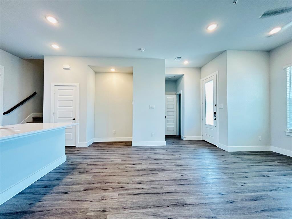 760 West Bedford Euless Road, Unit 200 Hurst, TX 76053 - Photo 33 of 39 a view of an empty room with wooden floor