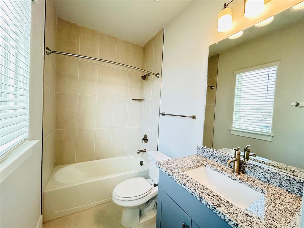 760 West Bedford Euless Road, Unit 200 Hurst, TX 76053 - Photo 36 of 39 a bathroom with a sink toilet vanity and bathtub
